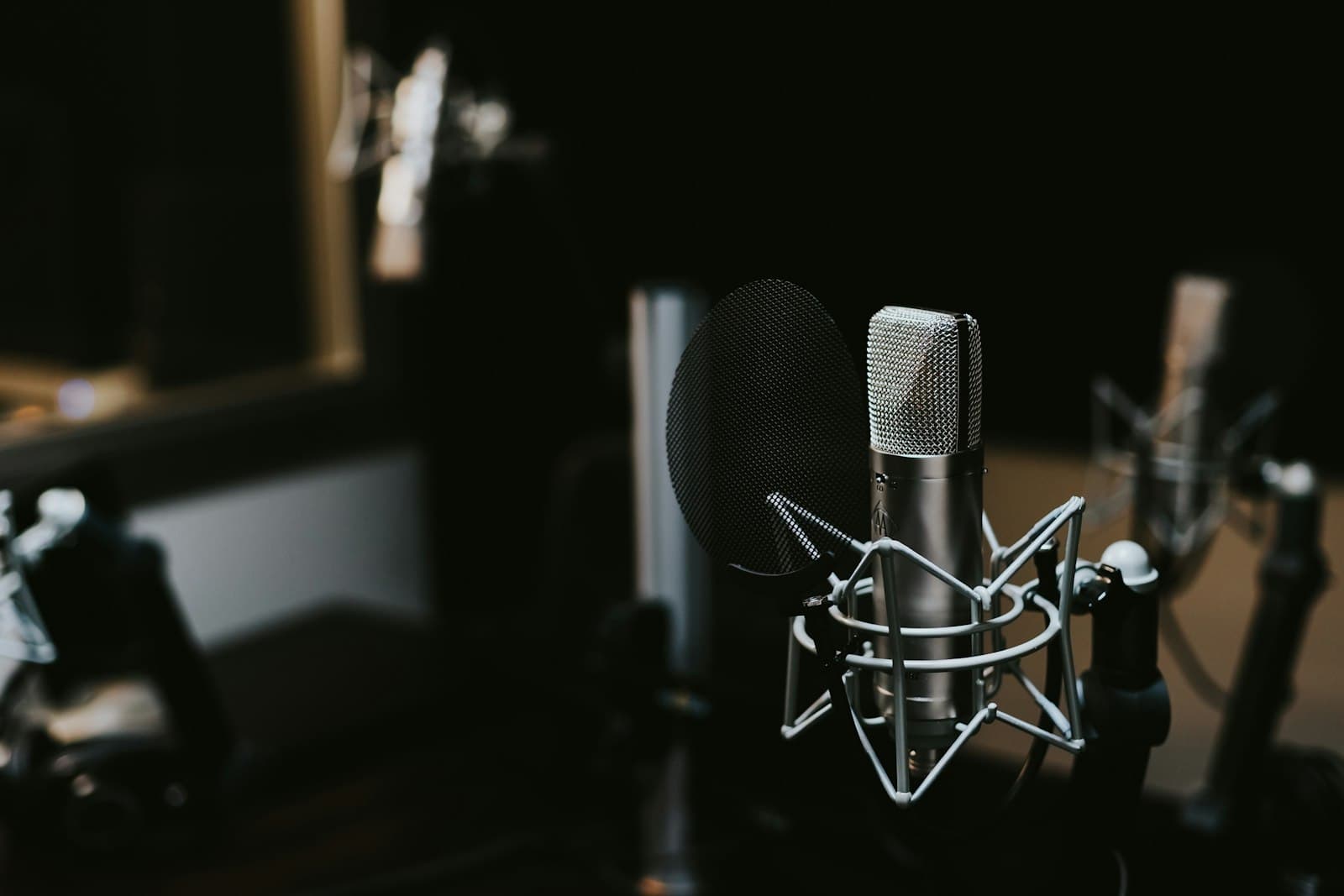Studio condenser microphone in a dark recording room